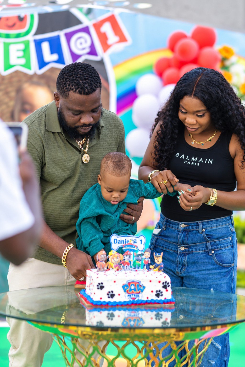 A family sharing a birthday cake moment at Donna’s Place