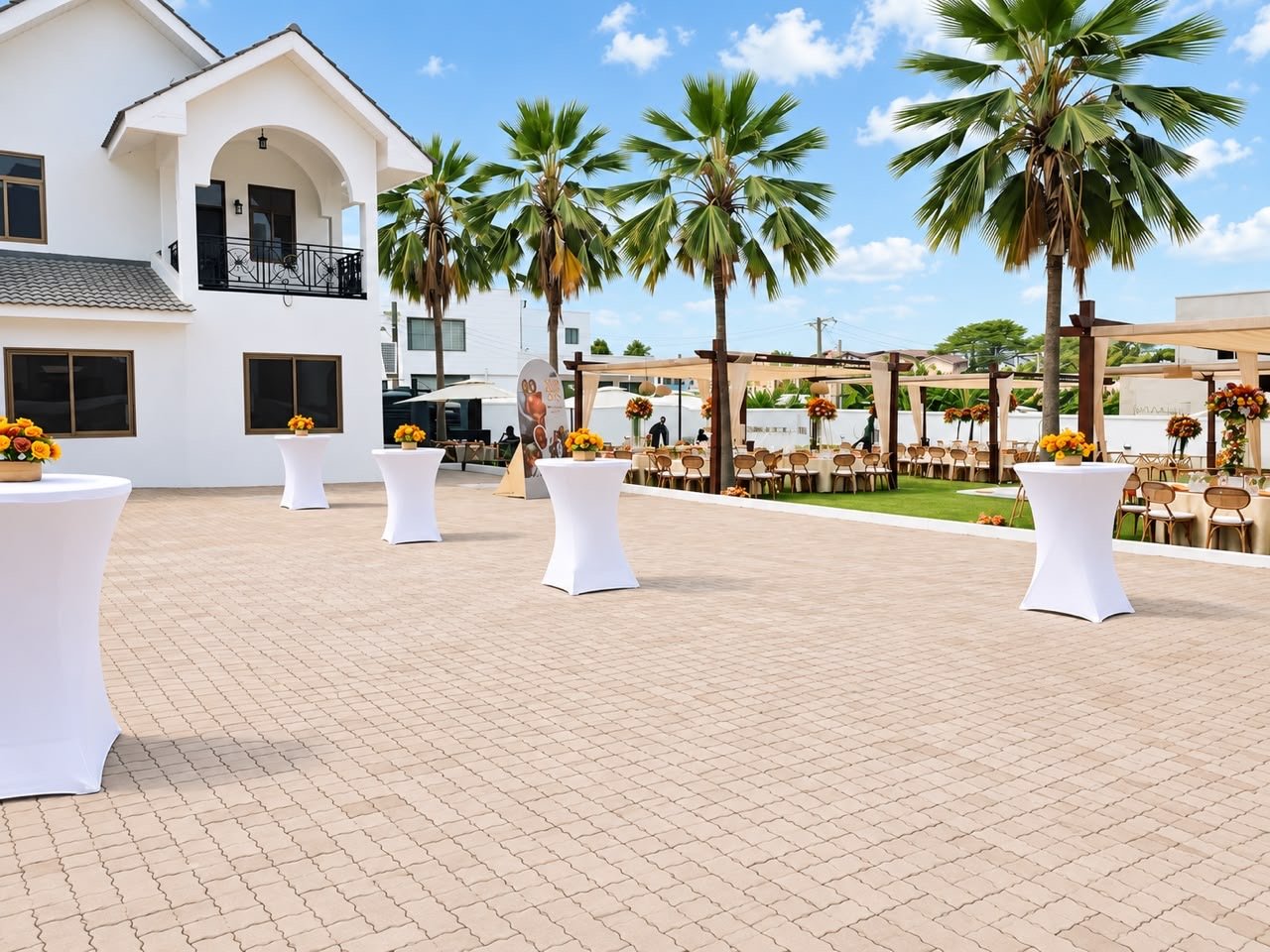 Cocktail tables and a celebration setup in the courtyard at Donna’s Place